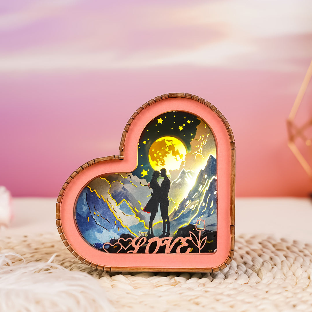Heart-shaped 3D wooden puzzle night light featuring a romantic silhouette under a moonlit sky.