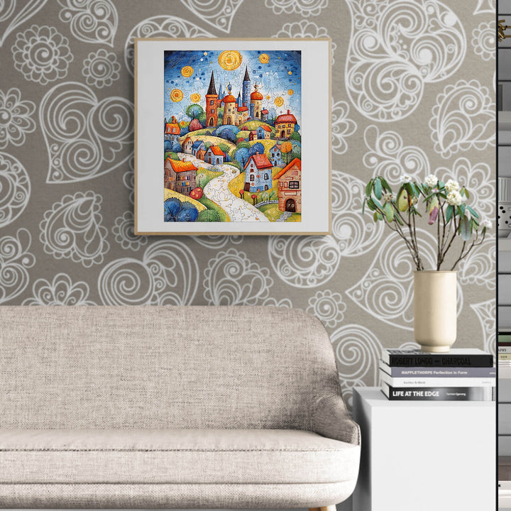 Colorful landscape painting by Pietro Gallo, showcasing charming houses and hills, displayed in a modern living room.