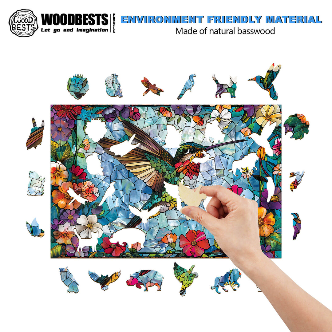 Hand placing a piece in the Stained Glass Hummingbird-4 wooden jigsaw puzzle made from natural basswood.