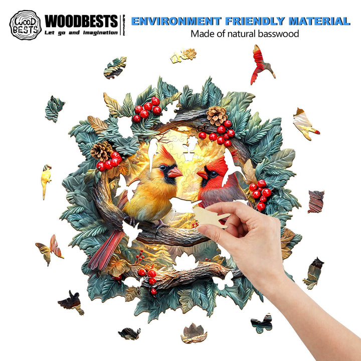 Person assembling a 3D Northern Cardinal wooden jigsaw puzzle with vibrant cardinals and foliage.