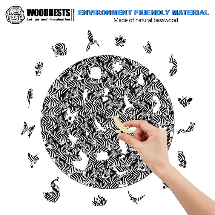 Person assembling a seek and find wooden jigsaw puzzle made from natural basswood in a circular design.