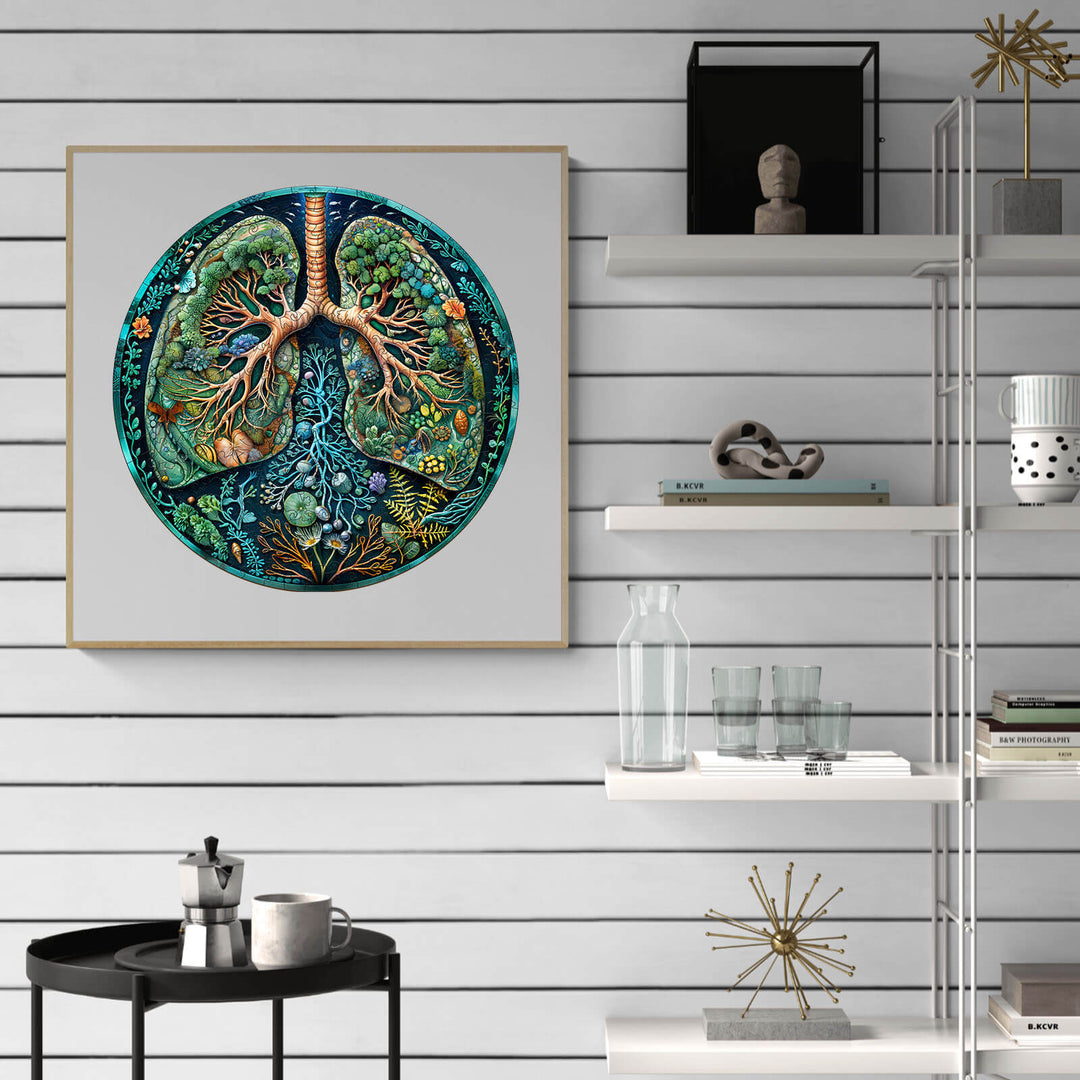 Colorful artwork of lungs with tree roots, on wall shelf showcasing modern home decor and greenery.