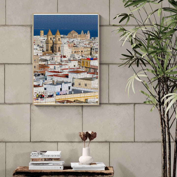 Exotic Town 500/1000 piece jigsaw puzzle displayed on a wall, showcasing an intricate cityscape design.