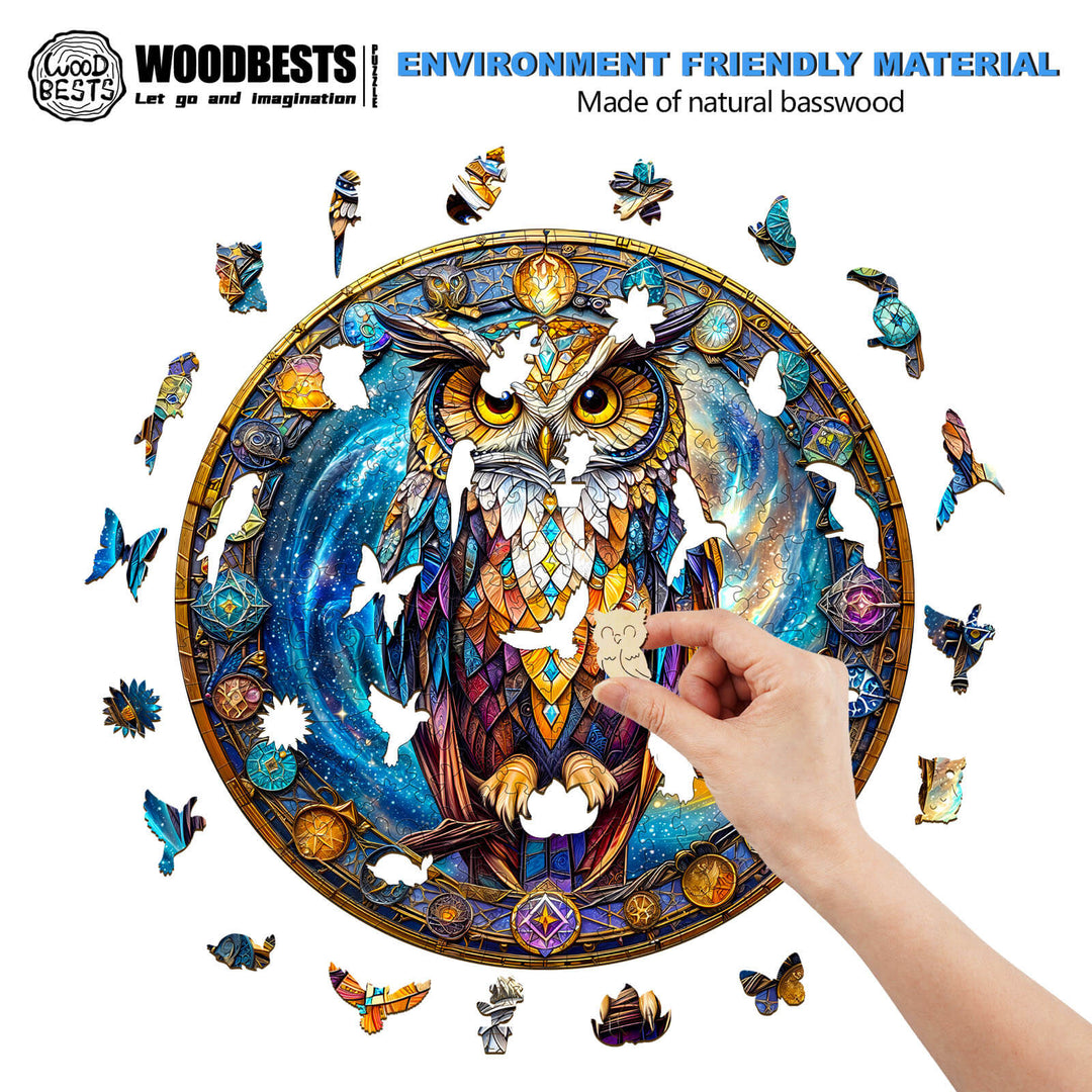 Person assembling the Cosmic Watcher wooden jigsaw puzzle featuring an owl design with colorful butterflies.