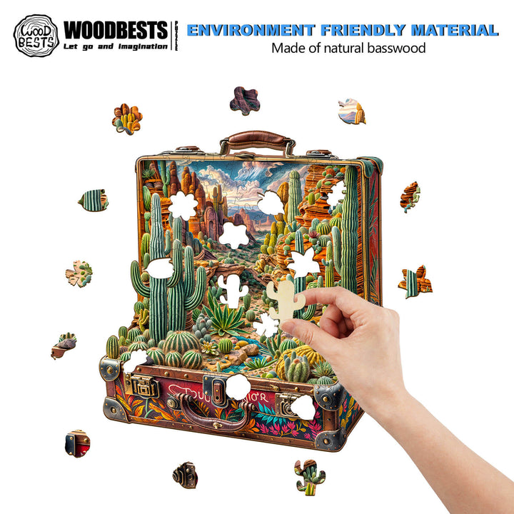 Person assembling Desert Odyssey-1 Wooden Jigsaw Puzzle featuring a colorful desert scene with cacti.