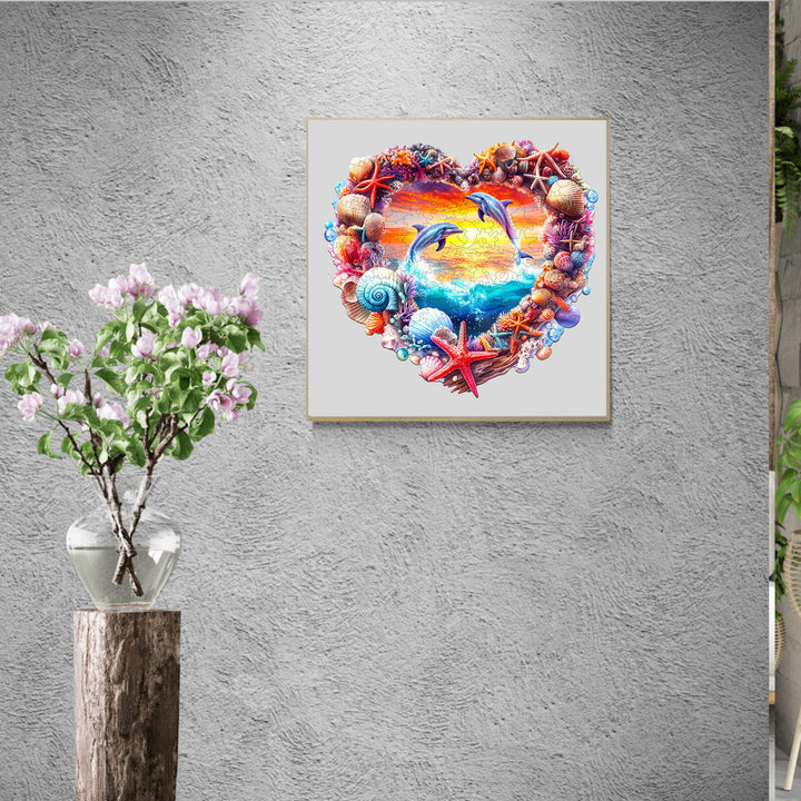 Colorful heart-shaped coral and dolphin jigsaw puzzle artwork displayed on a wall with decorative plants.