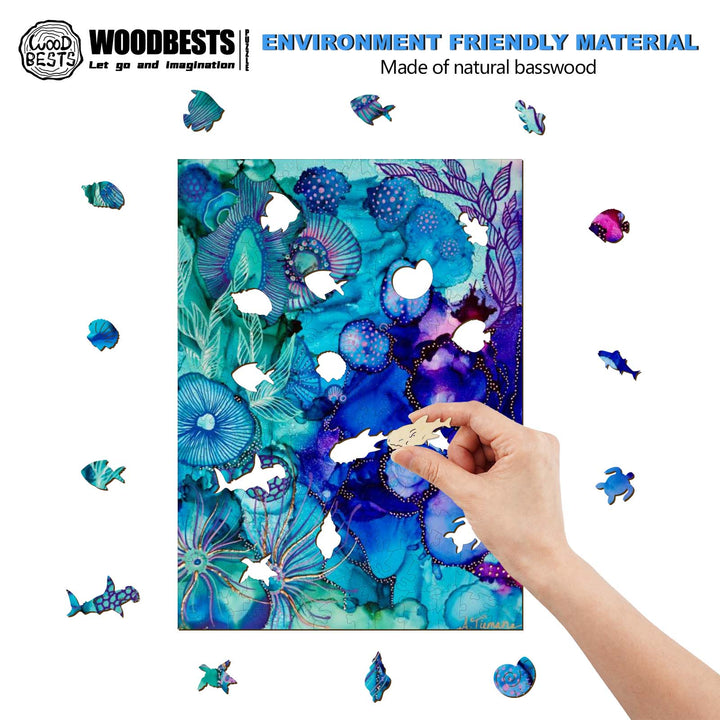 Hand placing a natural basswood puzzle piece on a colorful ocean-themed artwork, showcasing eco-friendly materials.