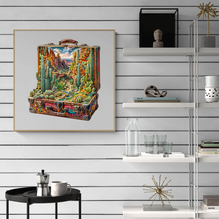 Colorful desert landscape artwork on a suitcase displayed on modern shelves, enhancing home decor.