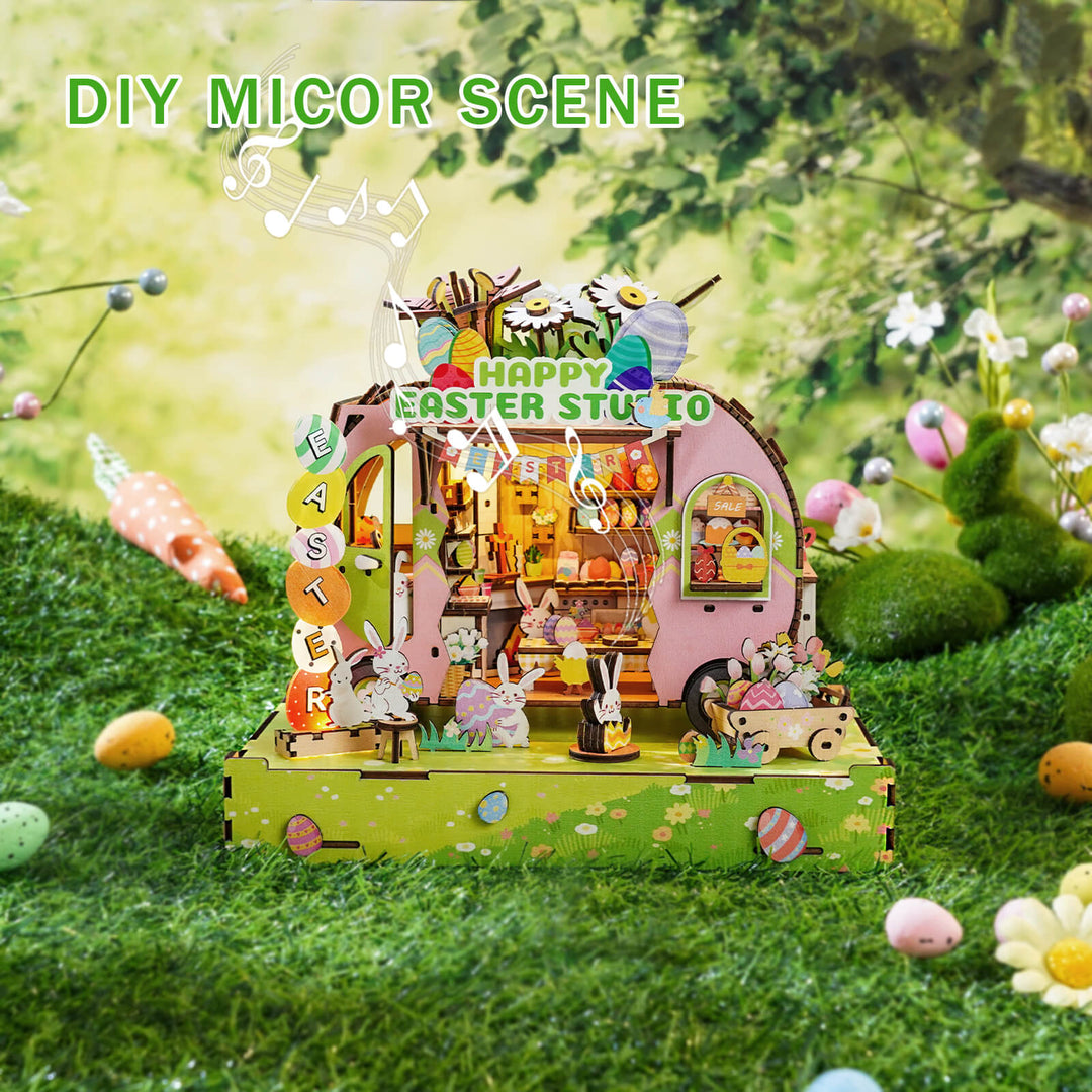 DIY miniature Easter egg cart scene with festive decorations and cheerful bunnies surrounded by colorful eggs.