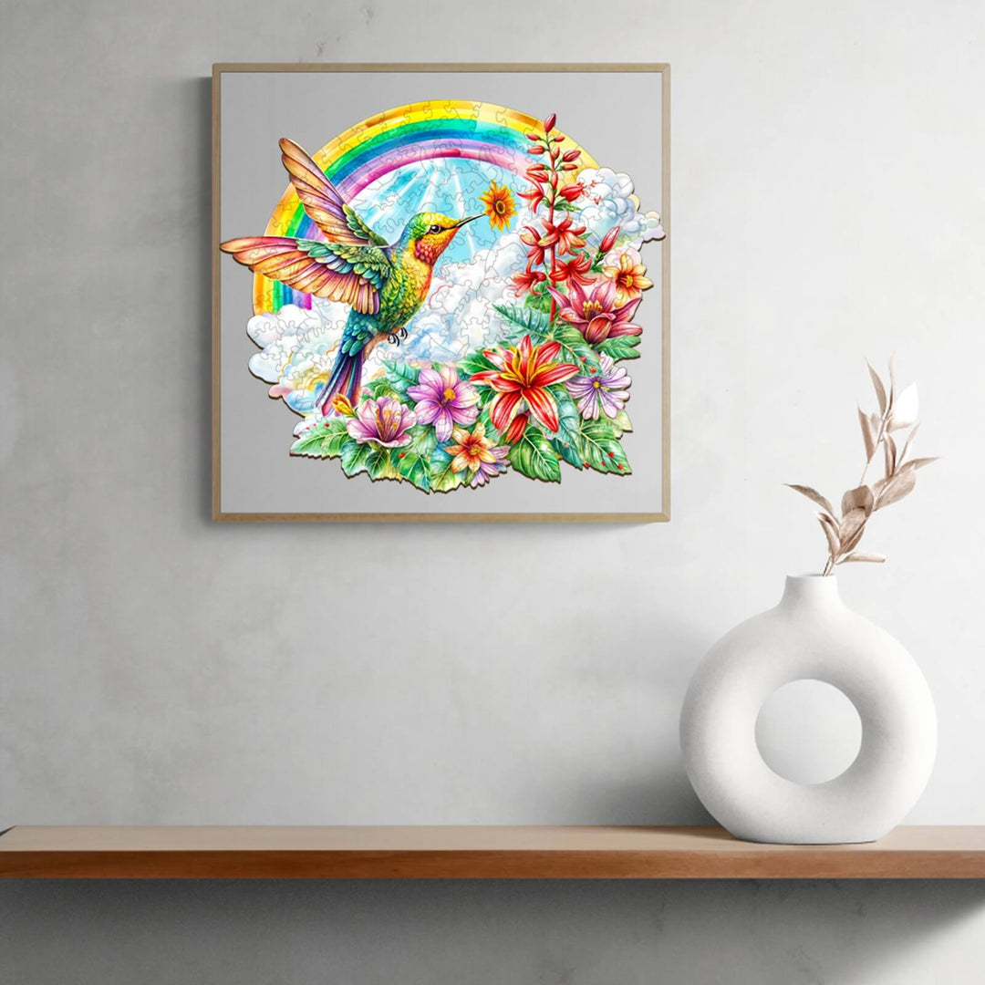 Angel Hummingbird wooden jigsaw puzzle artwork featuring vibrant flowers and a rainbow, perfect for puzzle lovers.