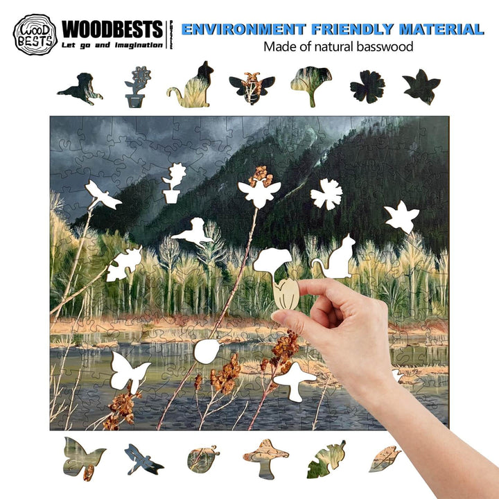 Person placing a wooden puzzle piece into a nature-themed jigsaw puzzle made of natural basswood.