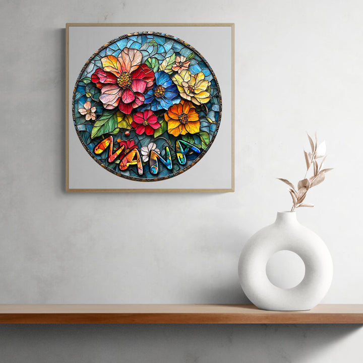 Vibrant floral art with the name 'NANA' in colorful letters, set against a circular stained glass design.