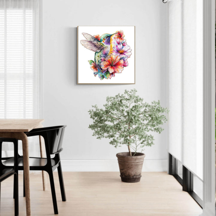 Hummingbirds in Flowers jigsaw puzzle artwork displayed in a bright, modern living room with a potted plant.