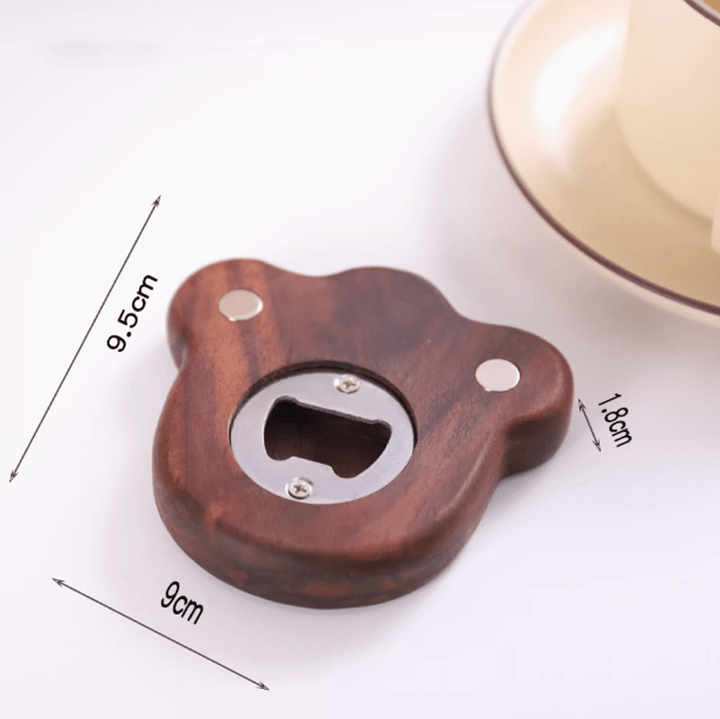 Natural maple wood bear-shaped bottle opener with magnetic suction, perfect for adding fun to your kitchen.