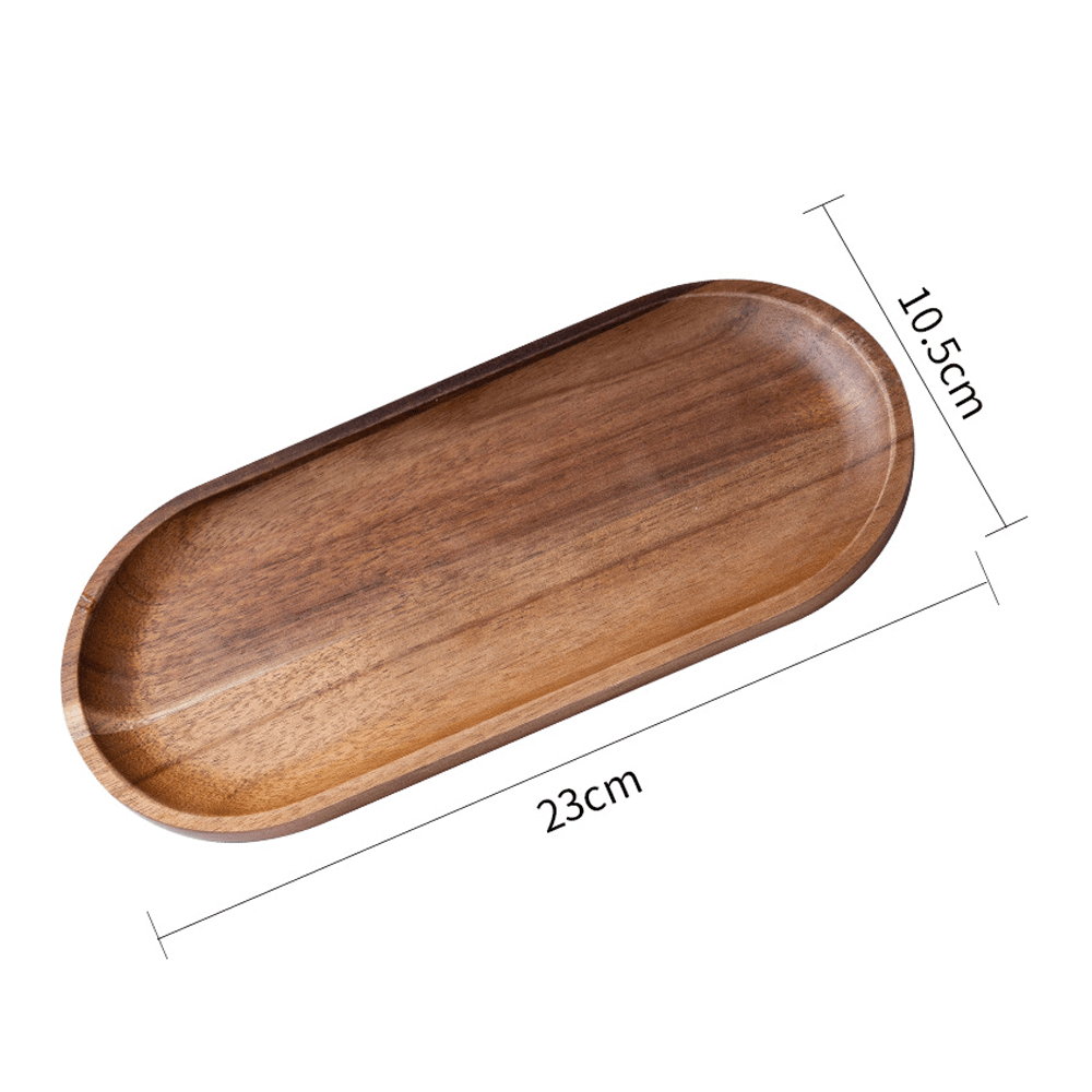 Organic acacia wood oval tray, 23cm x 10.5cm, perfect for storing small items with natural warmth.