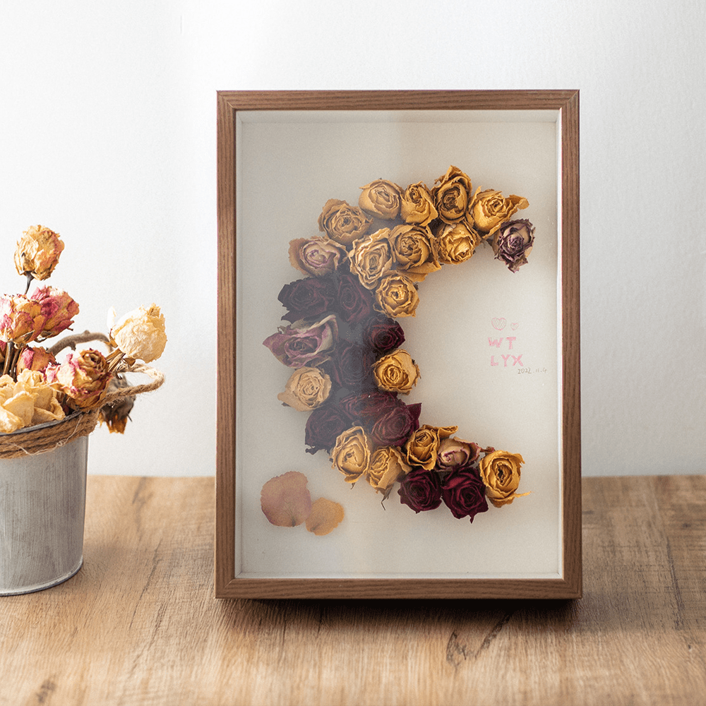 Deep inner frame specimen photo frame displaying dried roses in artistic arrangement.