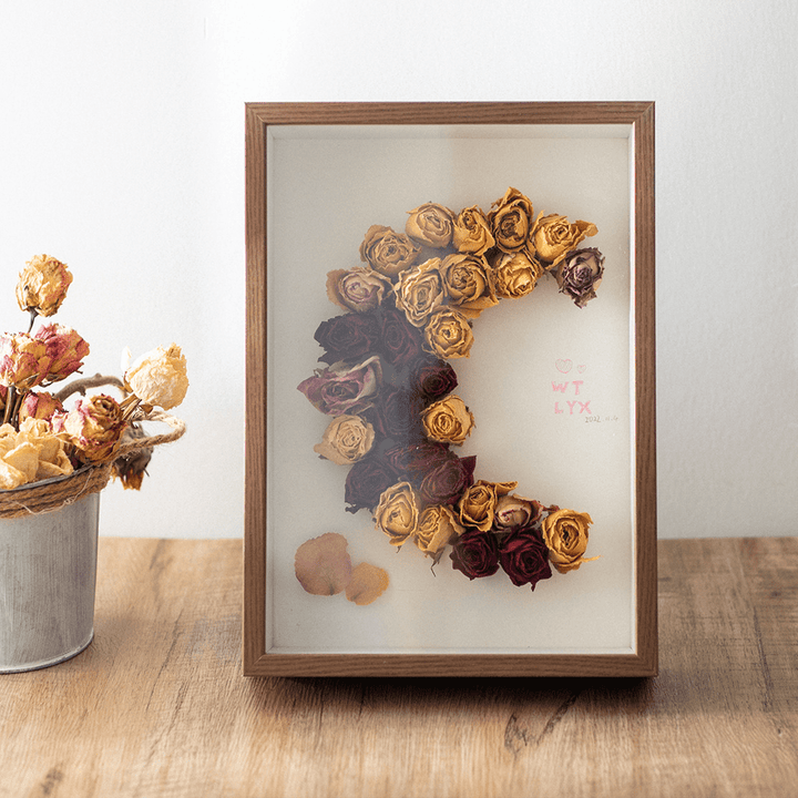 Deep inner frame specimen photo frame displaying dried roses in artistic arrangement.