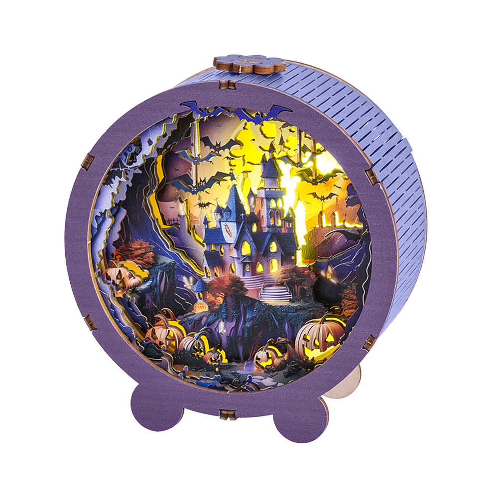 3D wooden puzzle night light featuring a Halloween castle scene with pumpkins and bats, illuminating the spooky landscape.