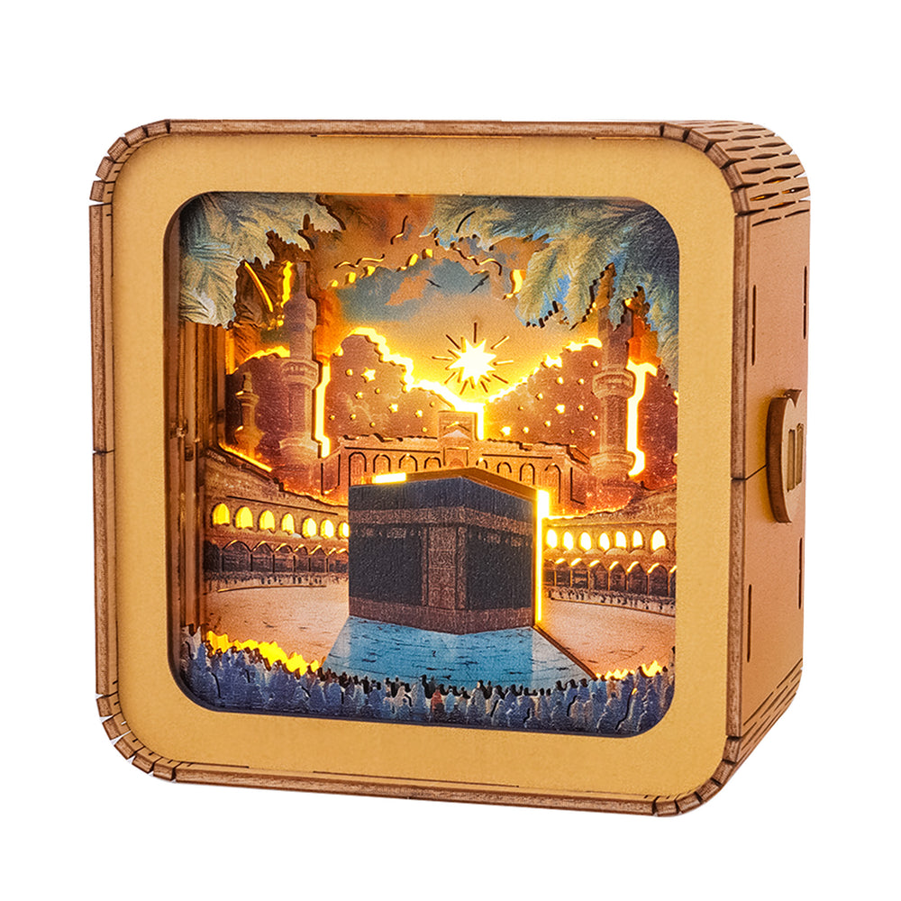 3D wooden puzzle night light featuring the Kaaba in Makkah with illuminated details and a scenic background.