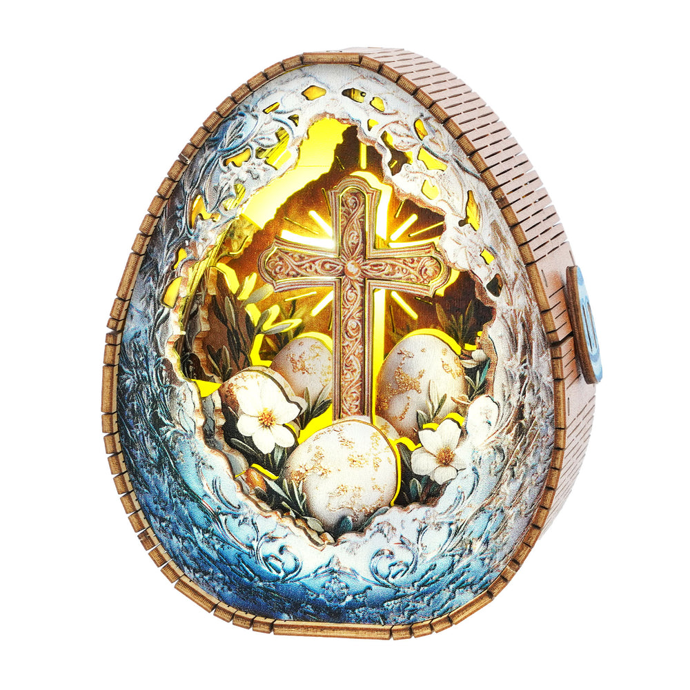 3D wooden puzzle night light in the shape of a decorated Easter egg with floral designs and a cross.