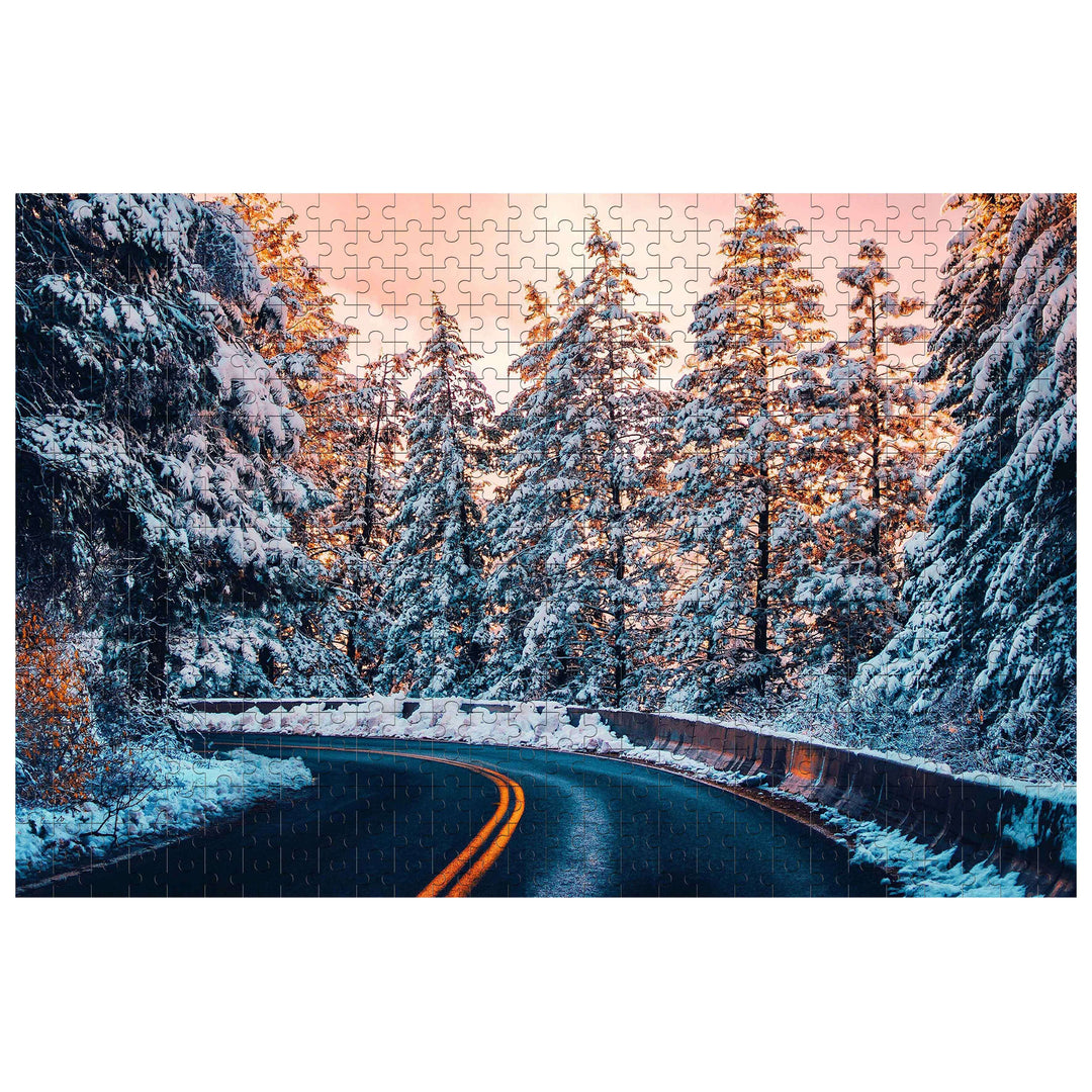 Snow Country Highway puzzle showing a snowy road surrounded by pine trees, perfect for jigsaw puzzle enthusiasts.