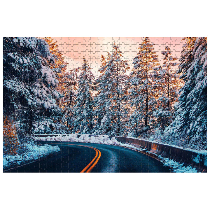 Snow Country Highway puzzle showing a snowy road surrounded by pine trees, perfect for jigsaw puzzle enthusiasts.