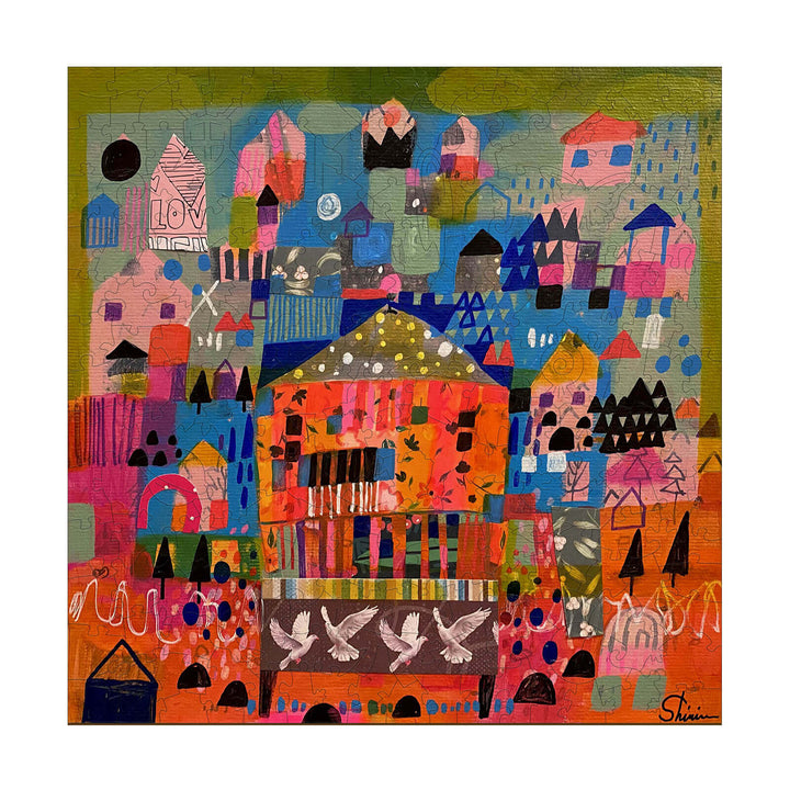 Colorful abstract artwork "This Shall Pass" by Shirin Moarefi featuring vibrant houses and doves.