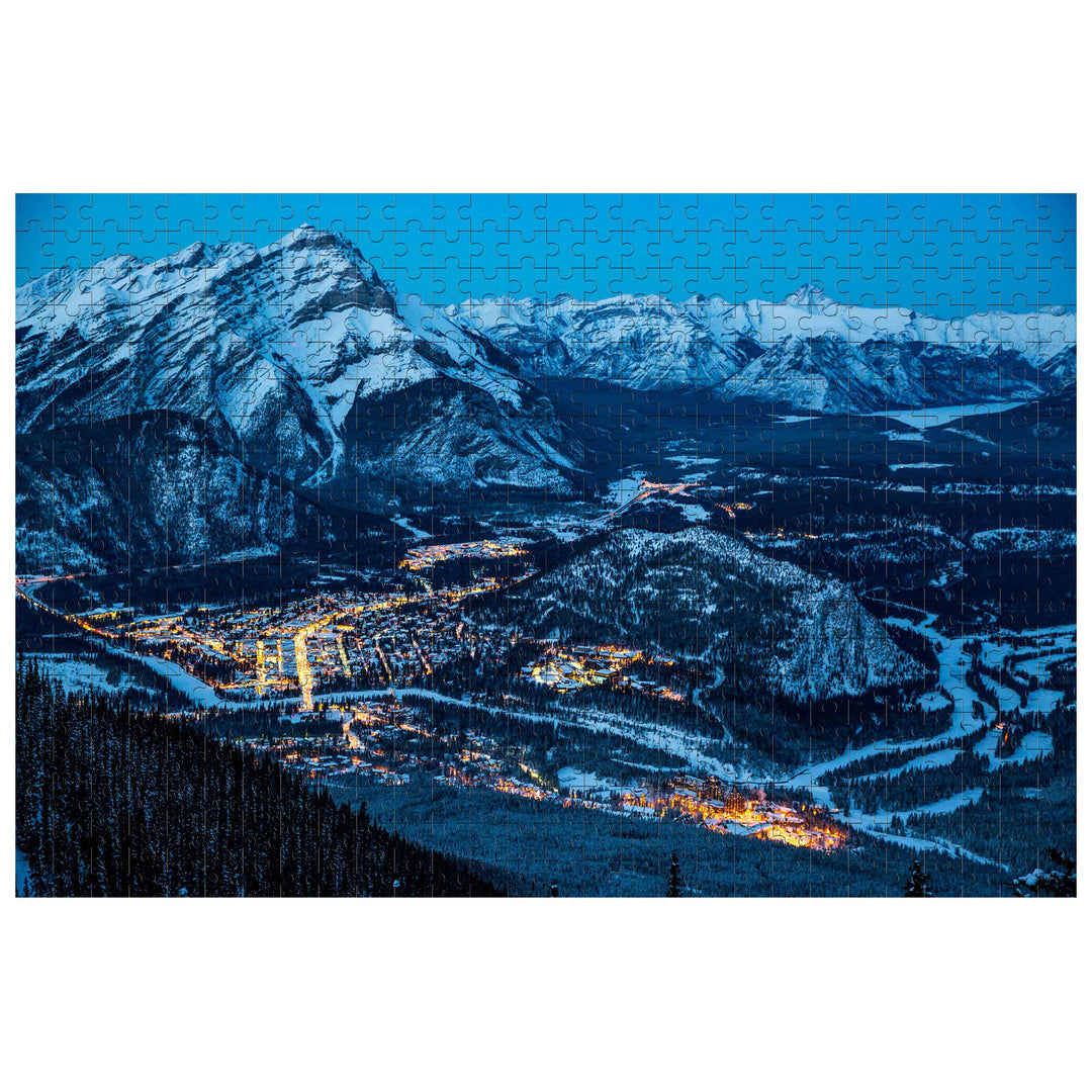Scenic view of a snowy mountain town at night depicted in the Winter Morning 500/1000 piece puzzle.