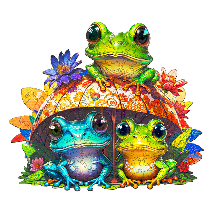 Colorful Frog Brothers wooden jigsaw puzzle featuring three frogs under a decorative umbrella with flowers.