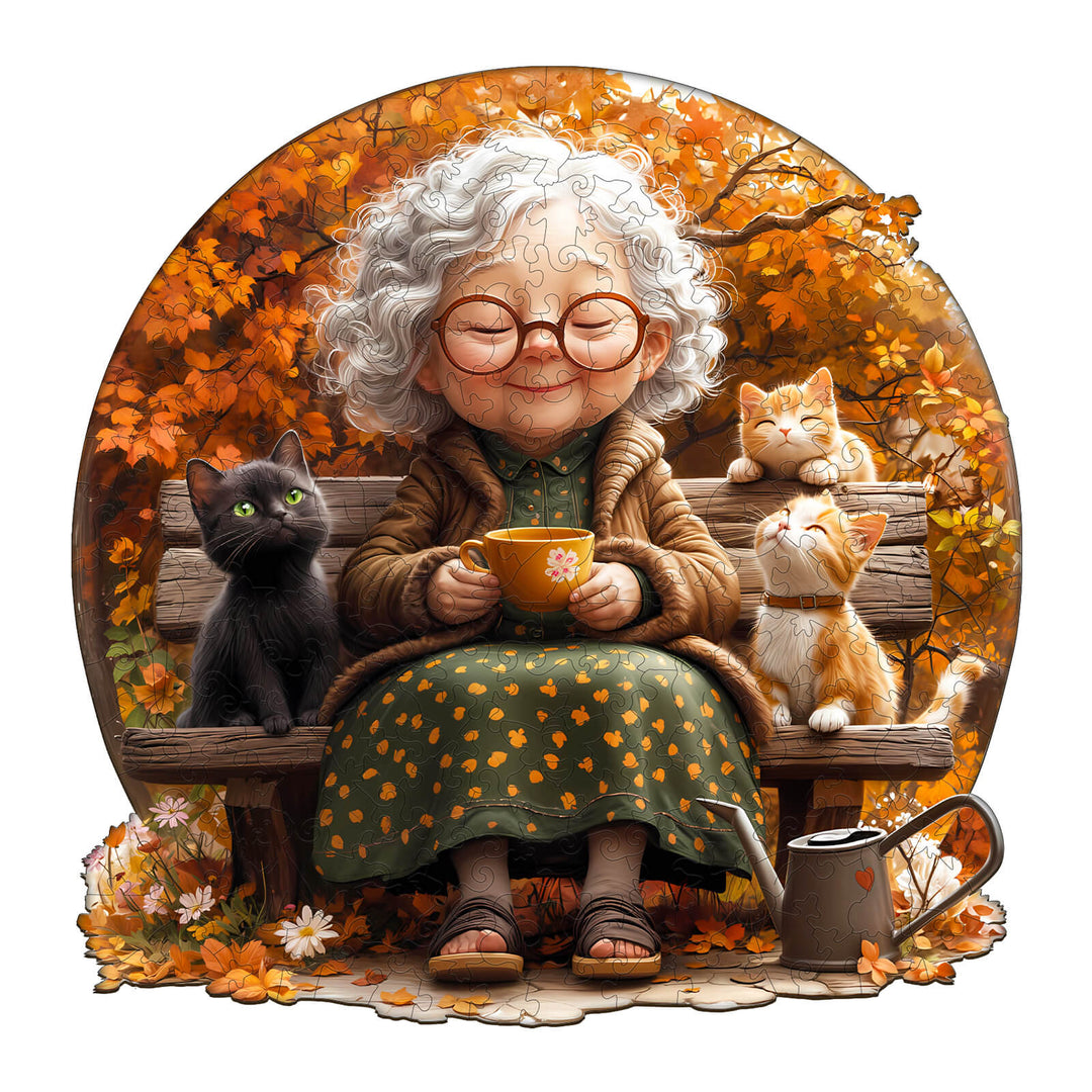 Grandma enjoying tea with three playful cats, surrounded by vibrant autumn leaves in a whimsical jigsaw puzzle illustration.