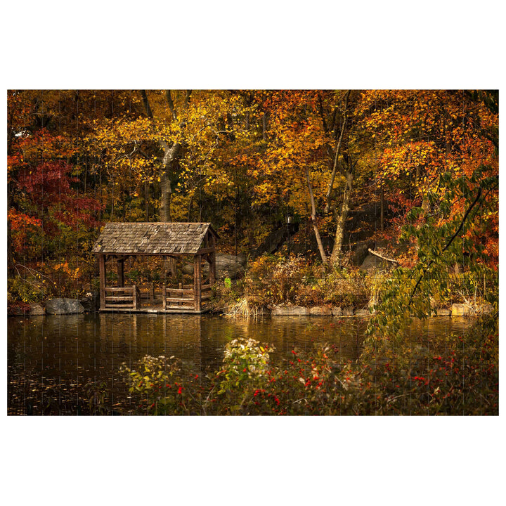Autumn Lakeside puzzle image featuring a serene dock by a pond surrounded by fall foliage.