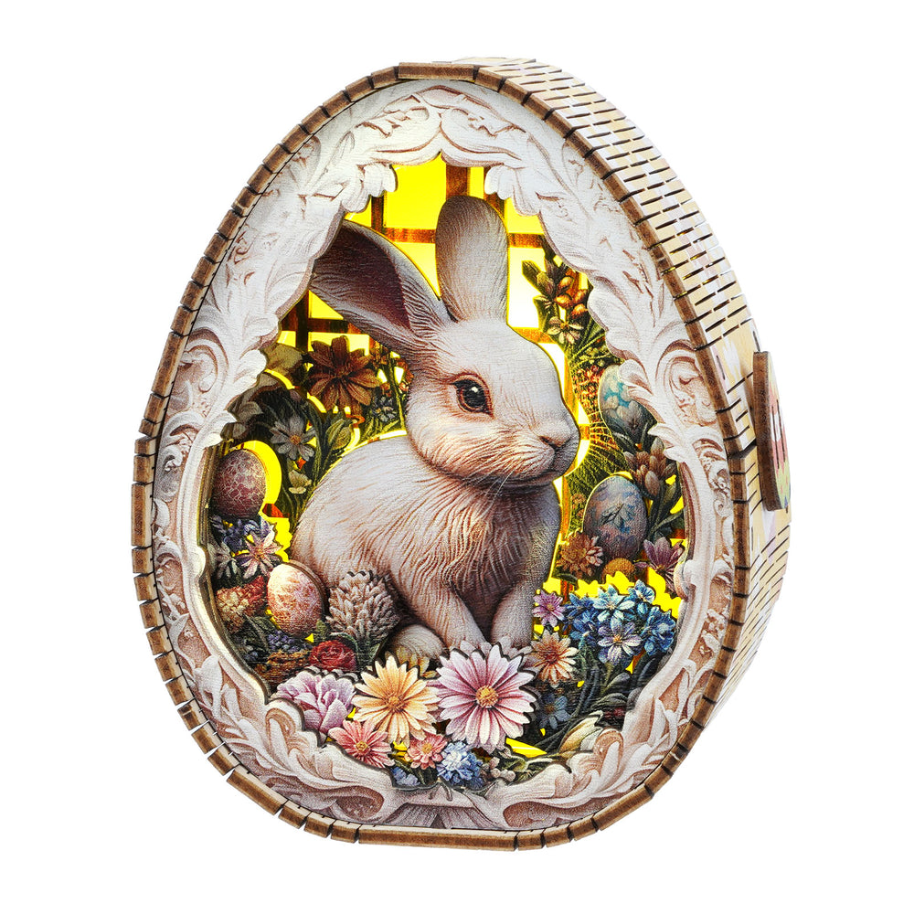 3D wooden Easter egg night light featuring a rabbit surrounded by colorful flowers.