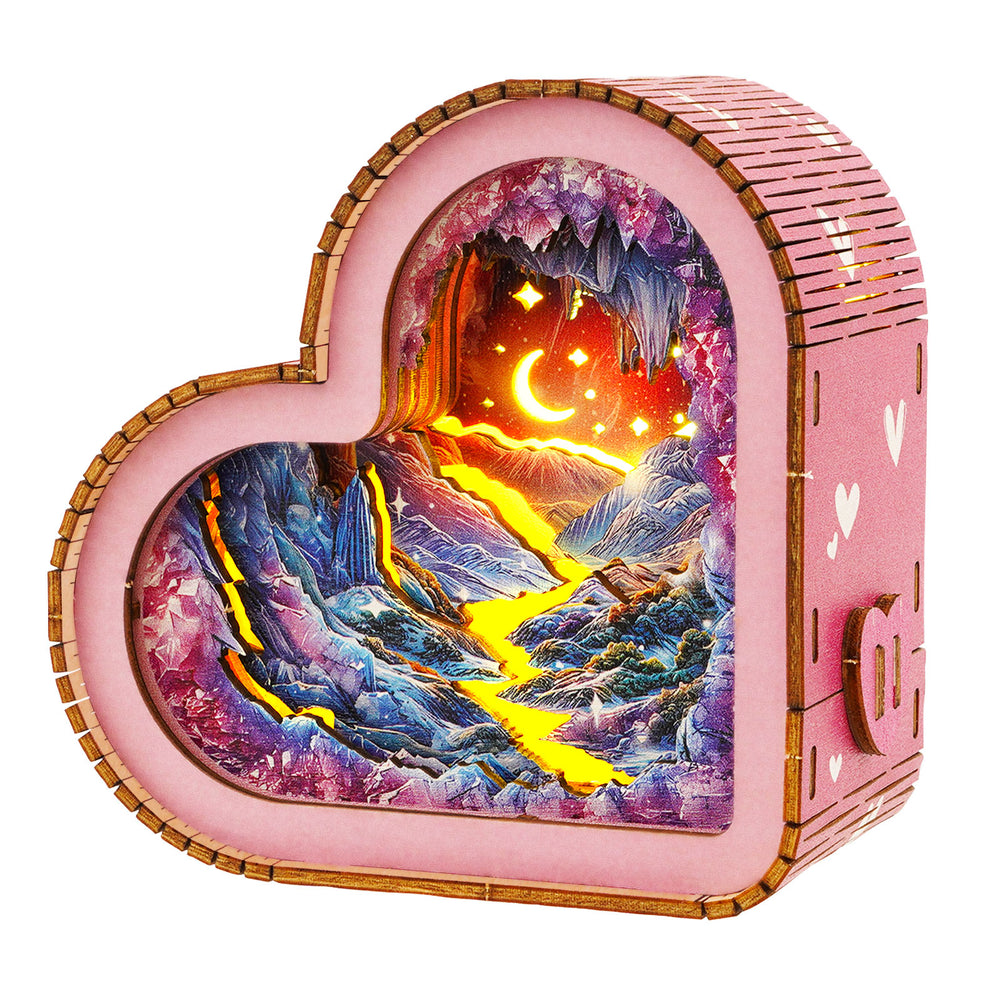 Heart-shaped 3D wooden puzzle night light featuring a colorful cave landscape with a glowing river and stars.