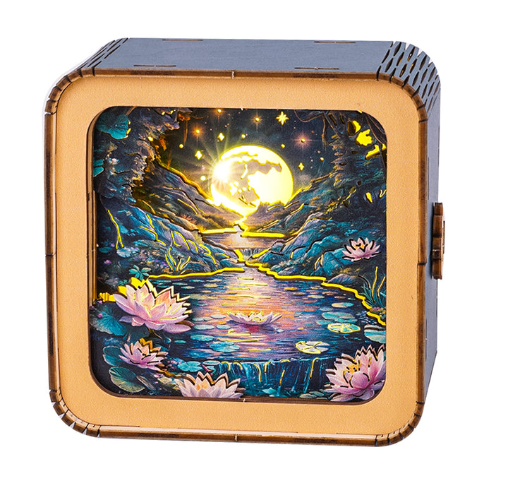 3D wooden puzzle night light featuring a serene lotus pond under a moonlit sky, showcasing vivid colors and intricate design.