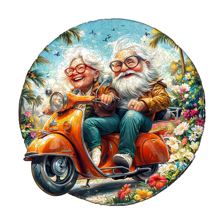 Wooden jigsaw puzzle of a joyful elderly couple riding a motorcycle through a vibrant floral landscape.