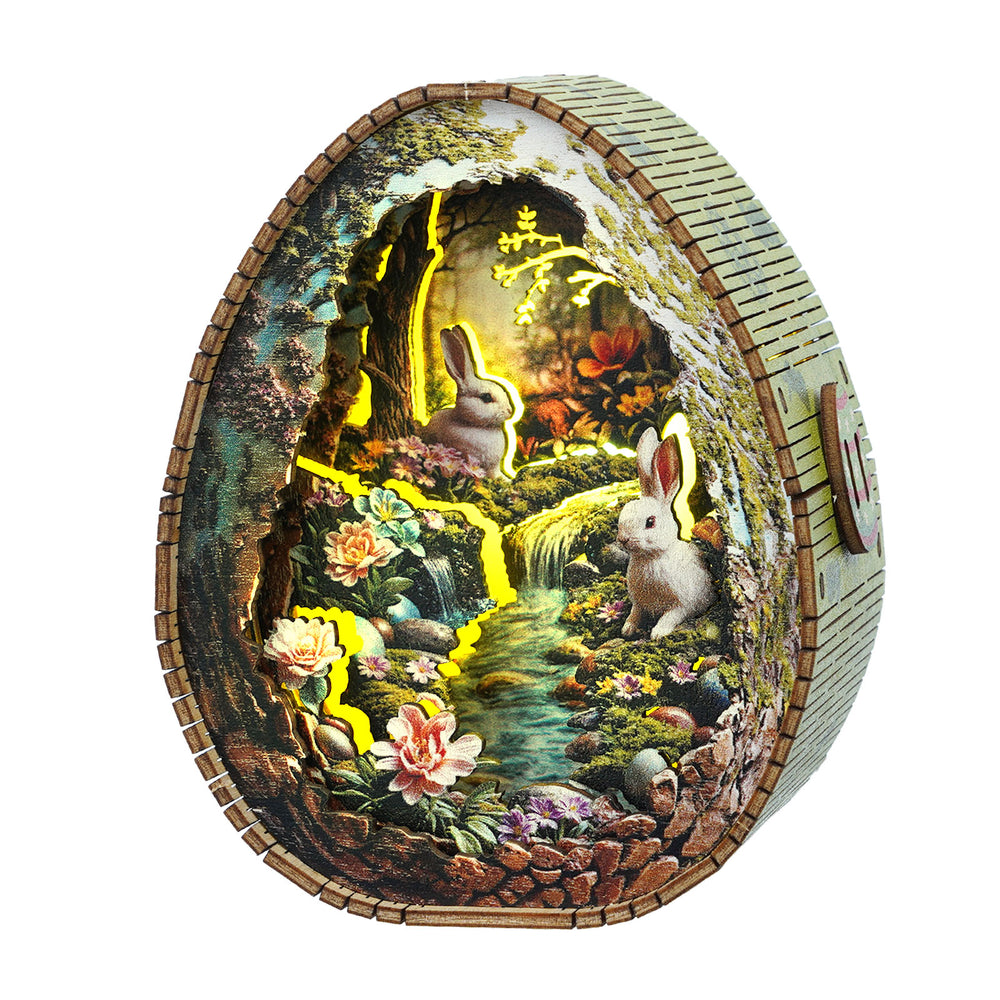 3D wooden puzzle night light featuring a rabbit scene by a stream with flowers and soft glowing lights.