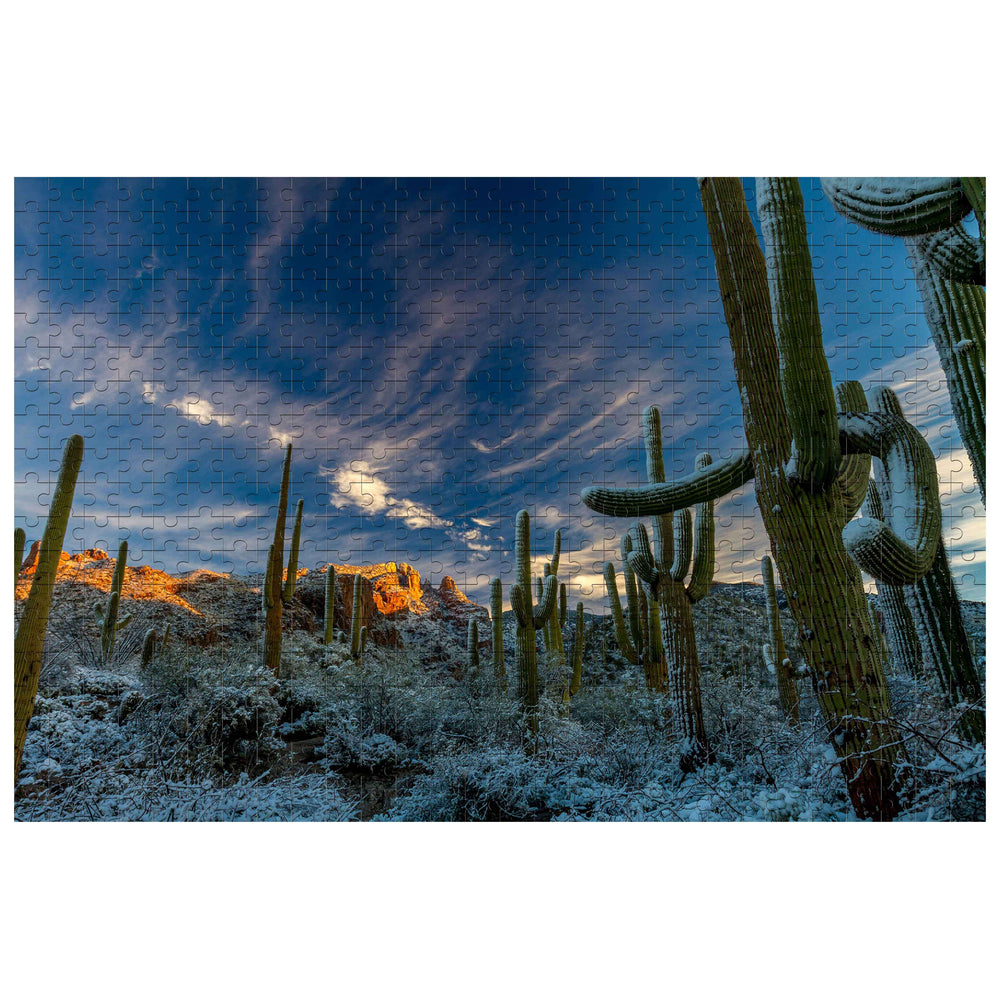 Snowy Desert 500/1000 piece puzzle featuring cacti in a winter landscape with a dramatic sky.