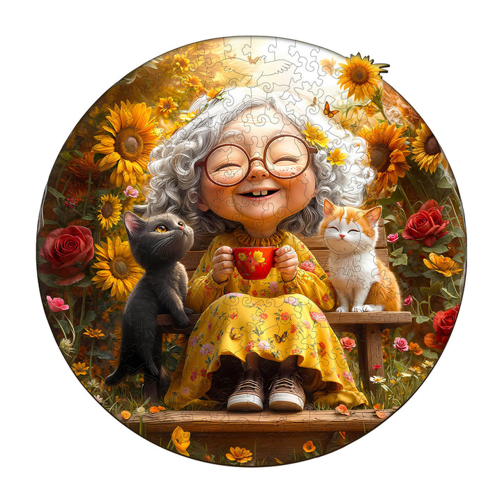 Cheerful elderly woman enjoying a sunny afternoon with two cats among vibrant flowers, perfect for jigsaw puzzle lovers.