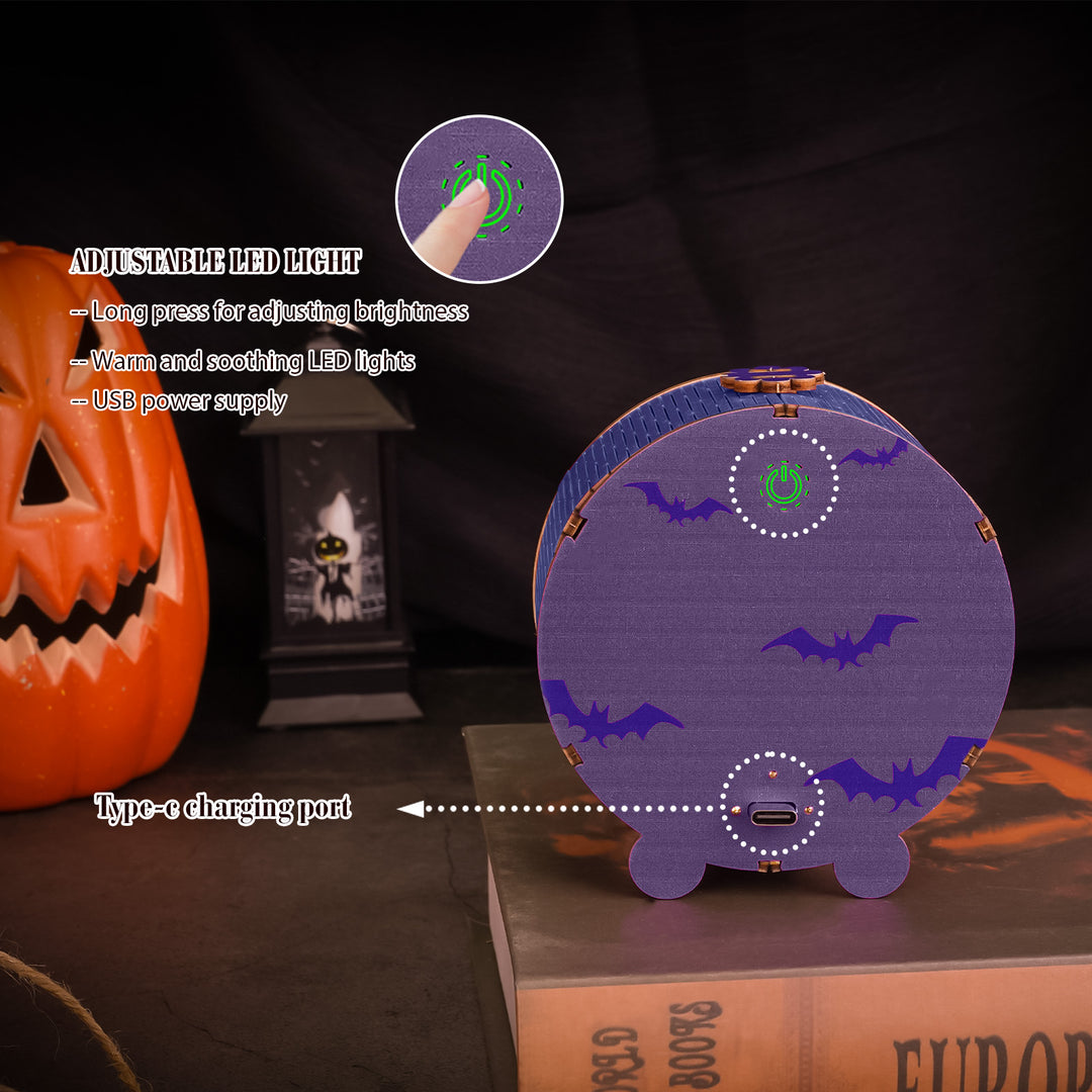Close-up of a Halloween Castle Night Light featuring adjustable LED lights, USB Type-C charging port, and bat designs.