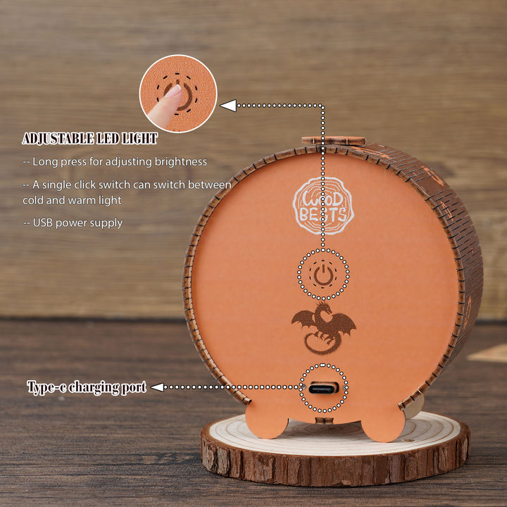 Close-up of the Mechanical Dragon Kit's adjustable LED light features and USB charging port on a wooden mount.