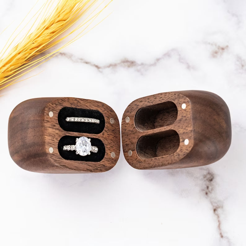 Custom walnut heart-shaped ring box featuring two slots for couples' rings, perfect for proposals and special occasions.