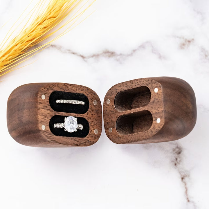 Custom walnut heart-shaped ring box featuring two slots for couples' rings, perfect for proposals and special occasions.