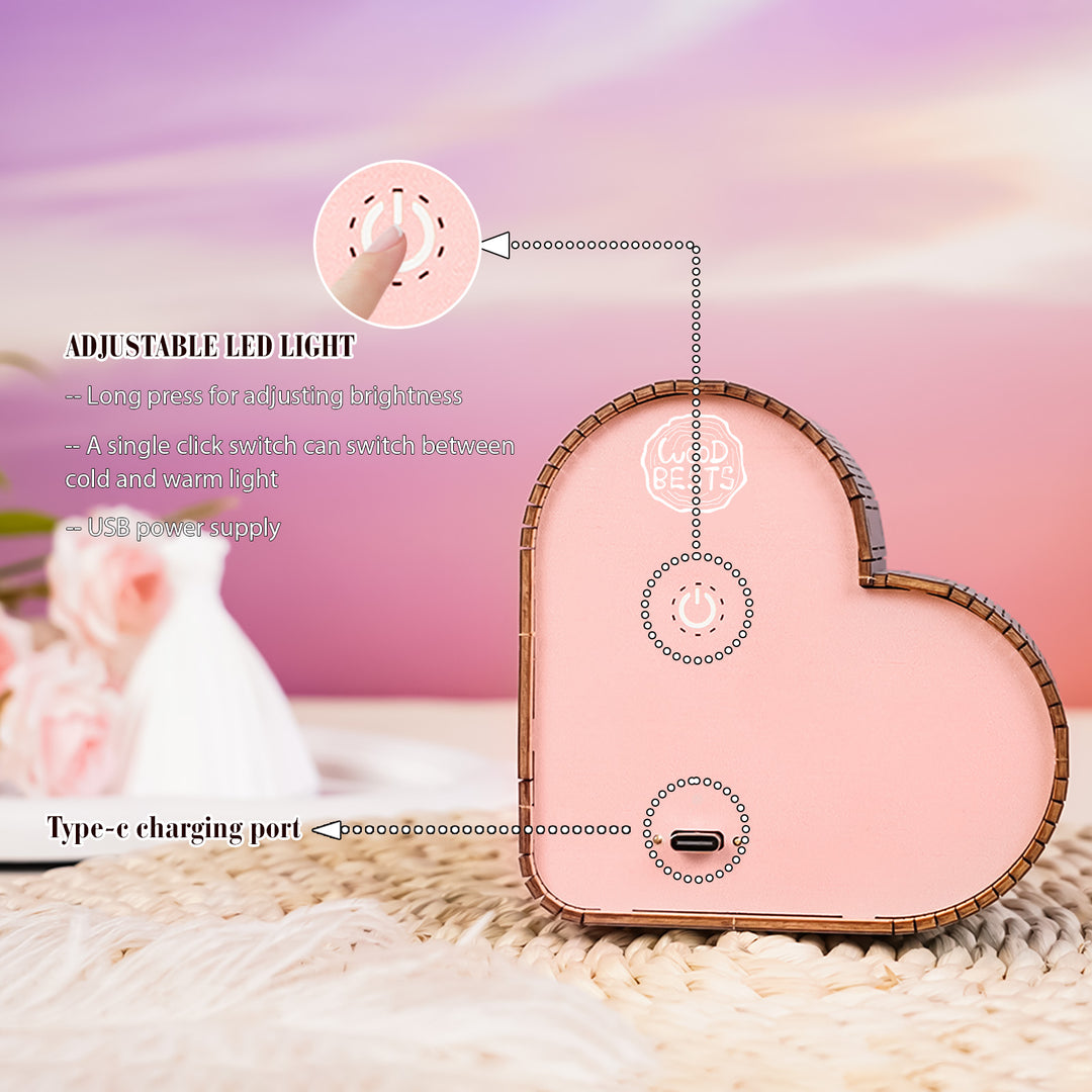 Close-up of the adjustable LED light on a heart-shaped 3D wooden puzzle night light, showing USB and Type-C ports.