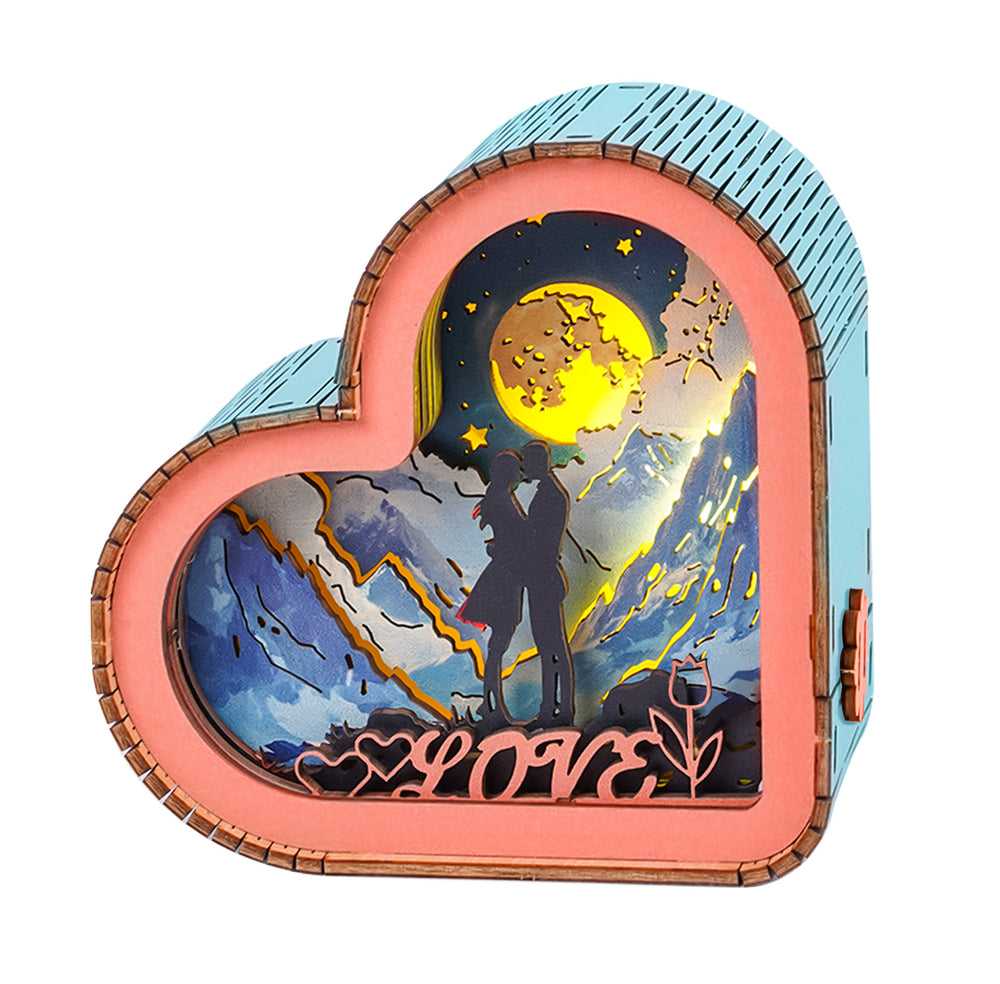 Heart-shaped 3D wooden puzzle night light featuring a romantic couple silhouette against a starry backdrop.