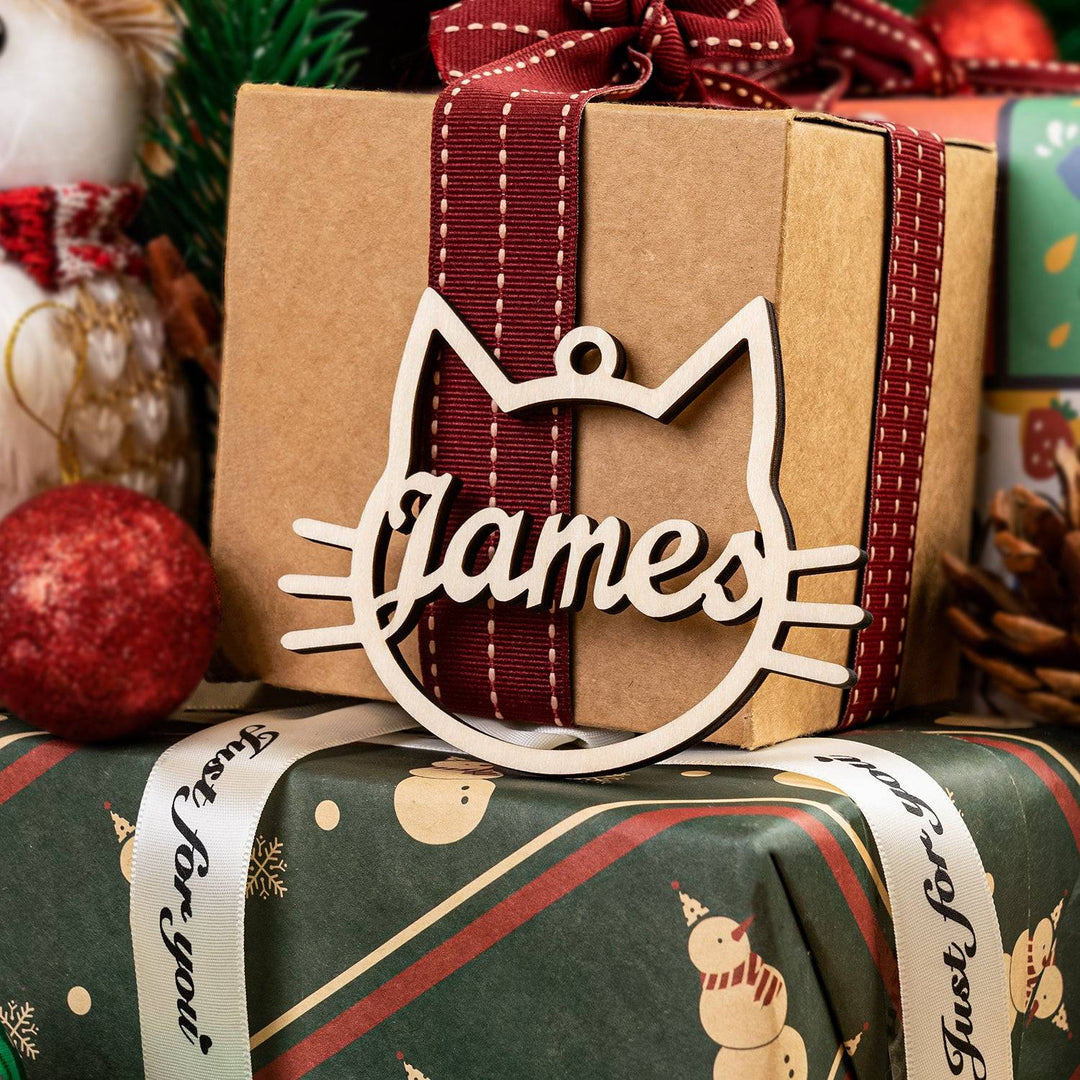 Personalized wooden cat ornament with the name 'James', perfect for holiday decorations.