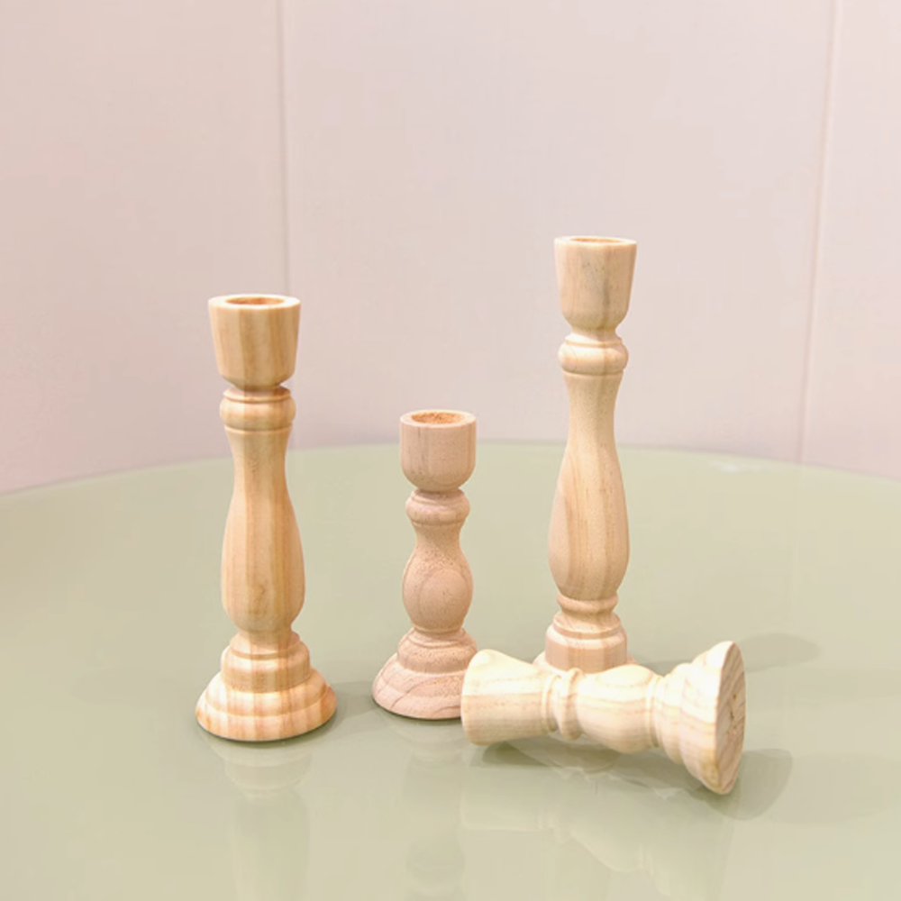 Nordic vintage wooden candle holders made of natural beech wood for creating a warm atmosphere.
