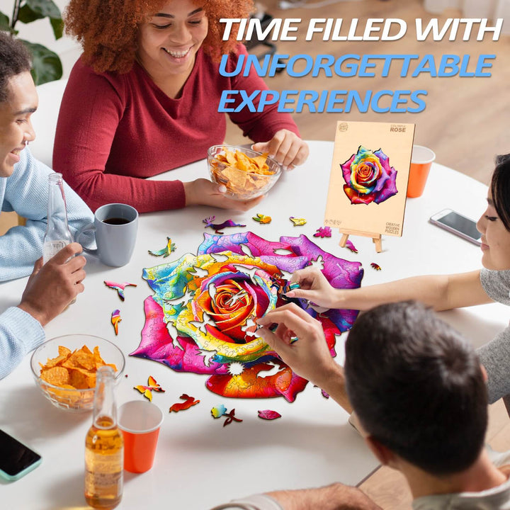 Group of friends enjoying the vibrant Colorful Rose wooden jigsaw puzzle with snacks in a cheerful atmosphere.