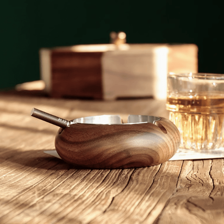 Round wooden ashtray made of walnut with stainless steel liner, perfect for home or office decor.