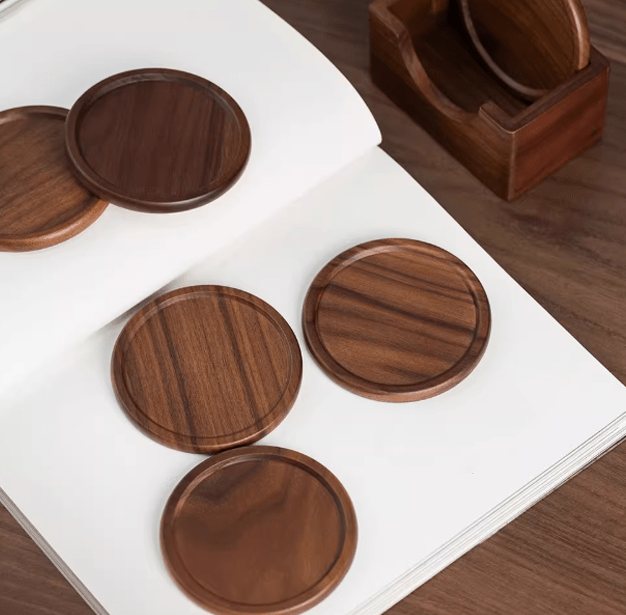 Minimalist walnut wooden coasters showcasing warm tones and natural texture on a table.