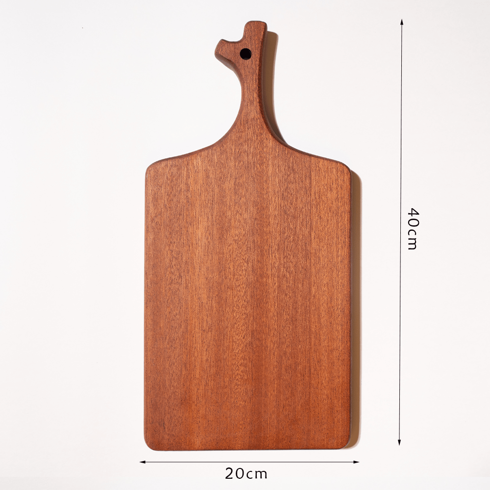 Multi-functional cutting board in branch design, crafted from natural ebony for artistic kitchen appeal.